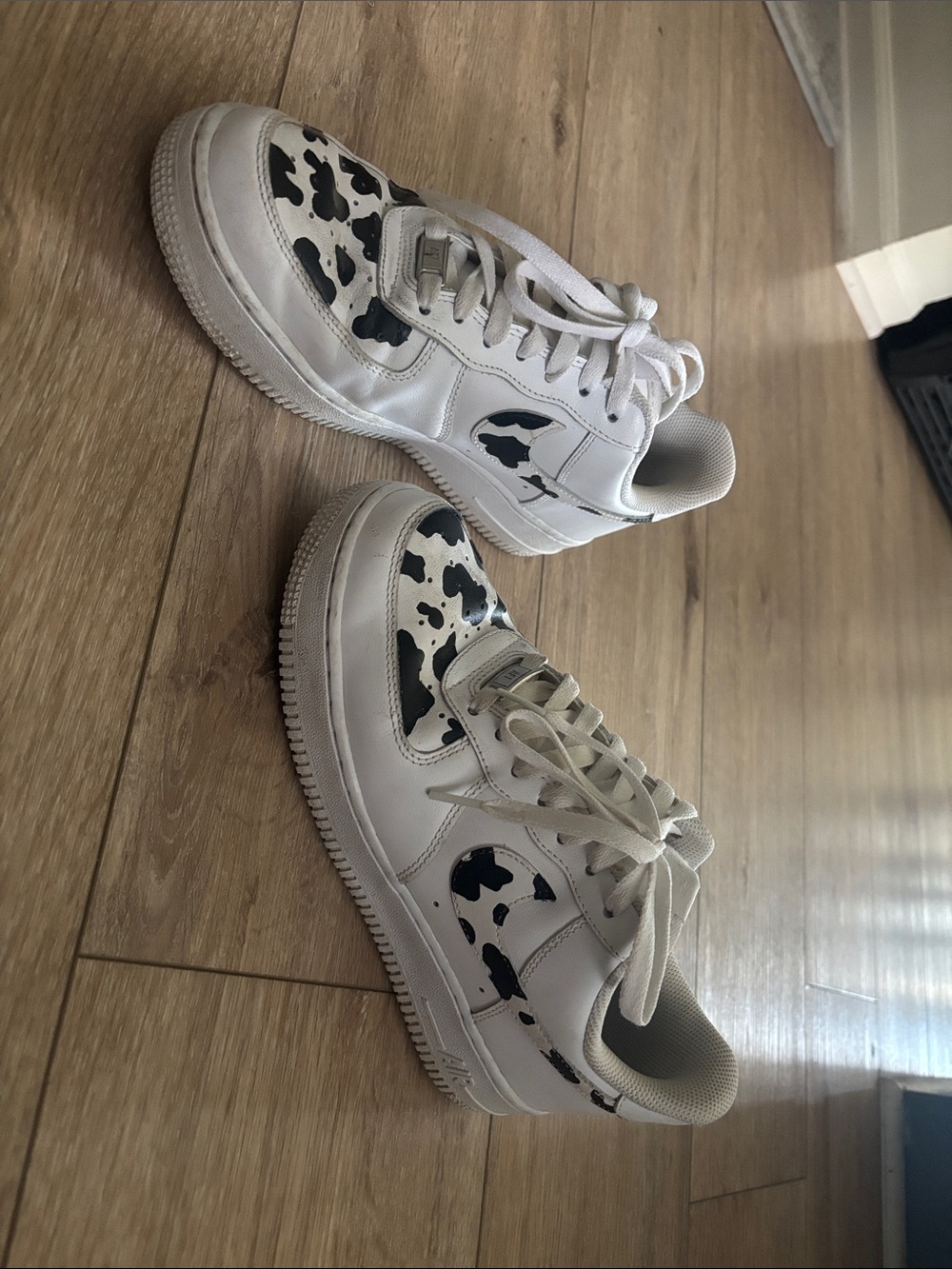 Hand painted cow print Air Force 1’s
